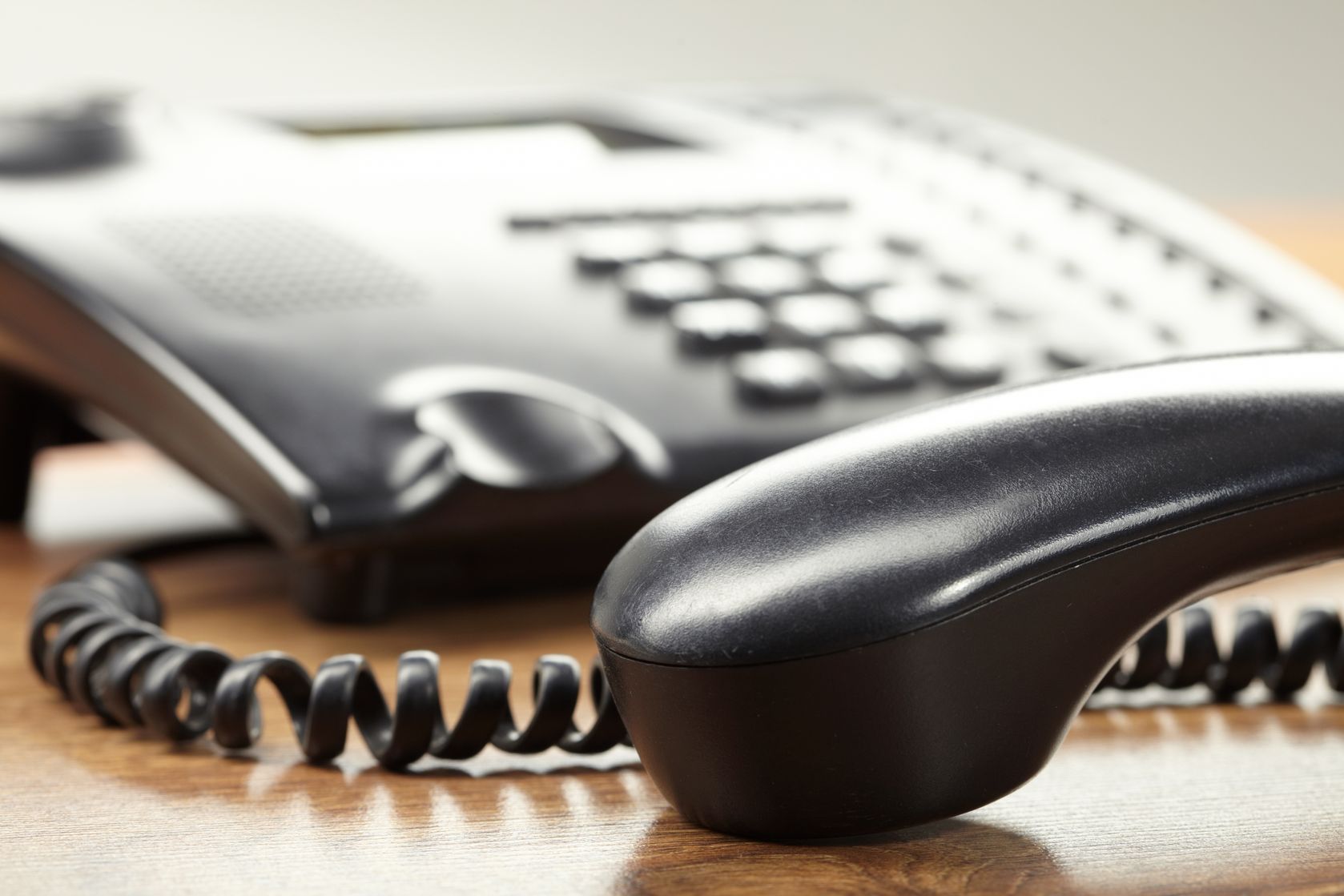 Desktop IP Phone on Desk with Handset Out of Cradle