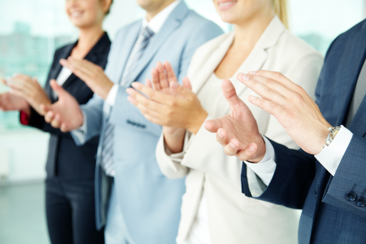 Business people clapping